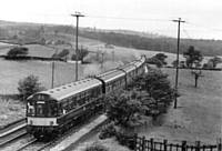 3 x 3 car with yellow front panel eastbound above Towneley, Burnley, on 16 July 1966. I Holt